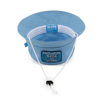 Light blue bucket hat turned crown down, showing the Mote interior label and the drawcord